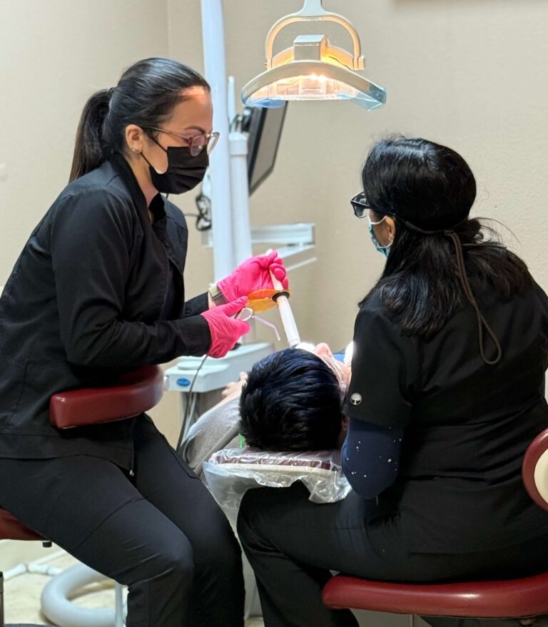 Dr. Pranati Chokshi providing dental treatment to a patient at her Winter Garden, FL practice